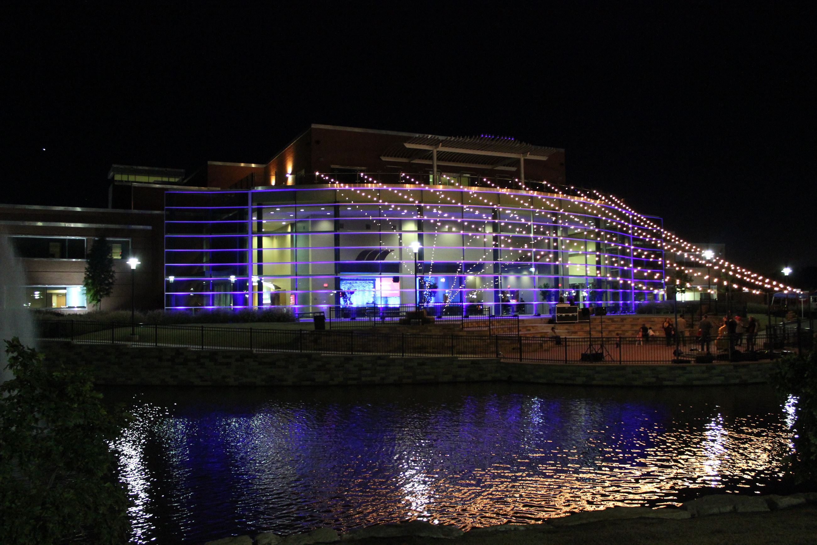 Outside of Conference Center at night with draped lights